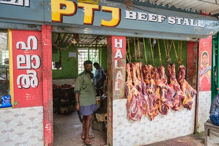 Indian cow or beef meat hanging up outside beef stall or shop , Munnar, Kerala, India, 2018