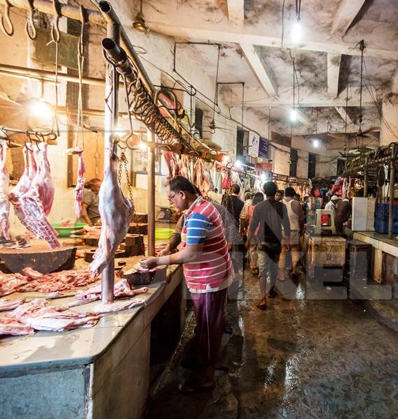 Goat meat hanging up at mutton shops in Crawford meat market, Mumbai, India, 2016