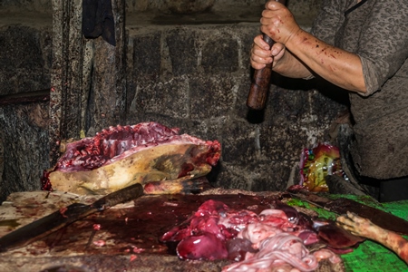 Dead dogs being cut up for meat at a dog market in Kohima in Nagaland, India, 2018