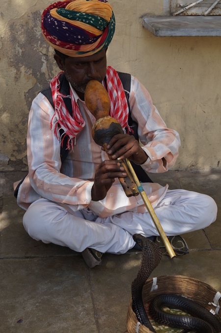Man playing pungi 