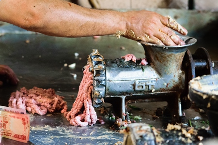 Mutton meat grinder at Crawford meat market