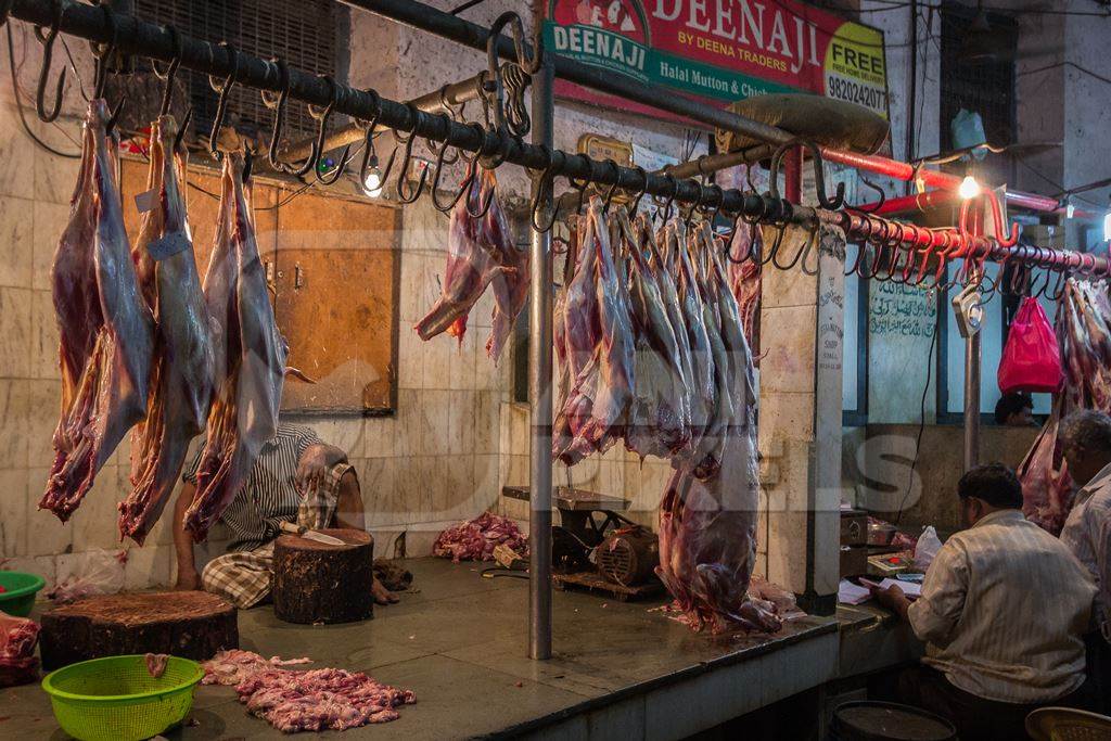 Goat meat hanging up at mutton shops in Crawford meat market, Mumbai, India, 2016