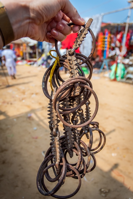 Illegal spiked bits for horses on sale at Pushkar camel fair in Rajasthan in India