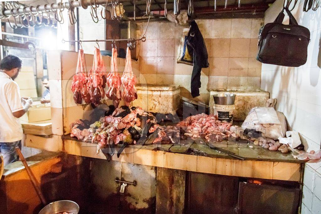 Goat meat hanging up at mutton shops in Crawford meat market, Mumbai, India, 2016