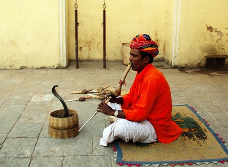 Man playing pungi 