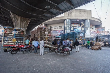 Broiler chickens raised for meat being unloaded from transport trucks near Crawford meat market in Mumbai