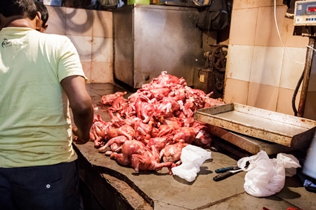 Indian broiler chickens being cut up at Crawford meat market in Mumbai in India, 2016