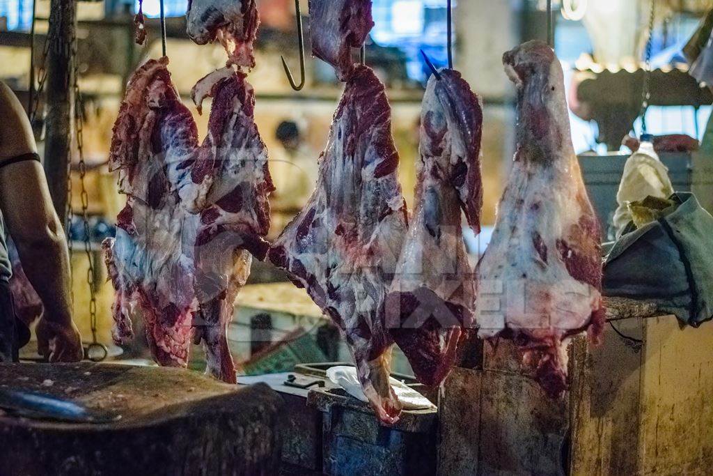Pieces of meat hanging up from hooks at Crawford meat market in Mumbai