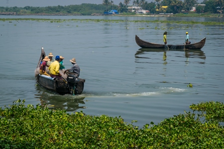 Fishing boats on the water at Kochi harbour in Kerala