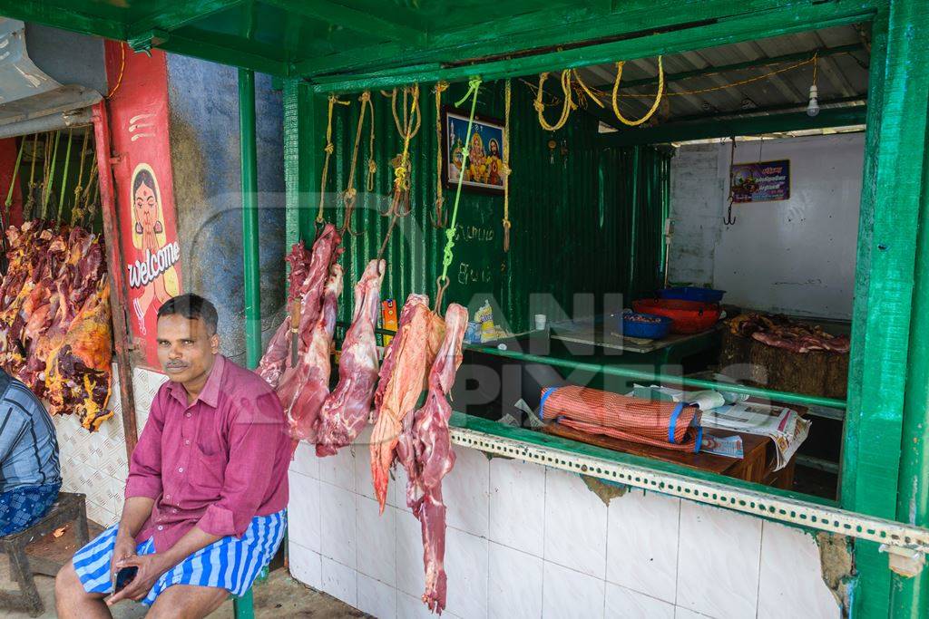 Indian cow or beef meat hanging up outside beef shop, Munnar, Kerala, India, 2018