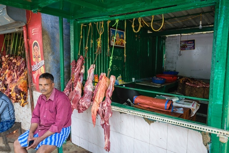 Indian cow or beef meat hanging up outside beef shop, Munnar, Kerala, India, 2018