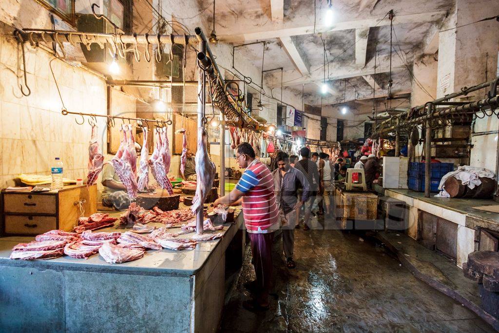 Goat meat hanging up at mutton shops in Crawford meat market, Mumbai, India, 2016