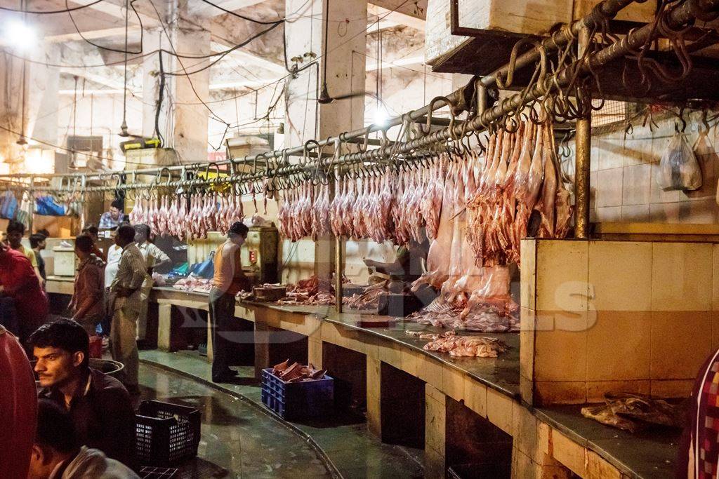 Goat meat hanging up at mutton shops in Crawford meat market, Mumbai, India, 2016