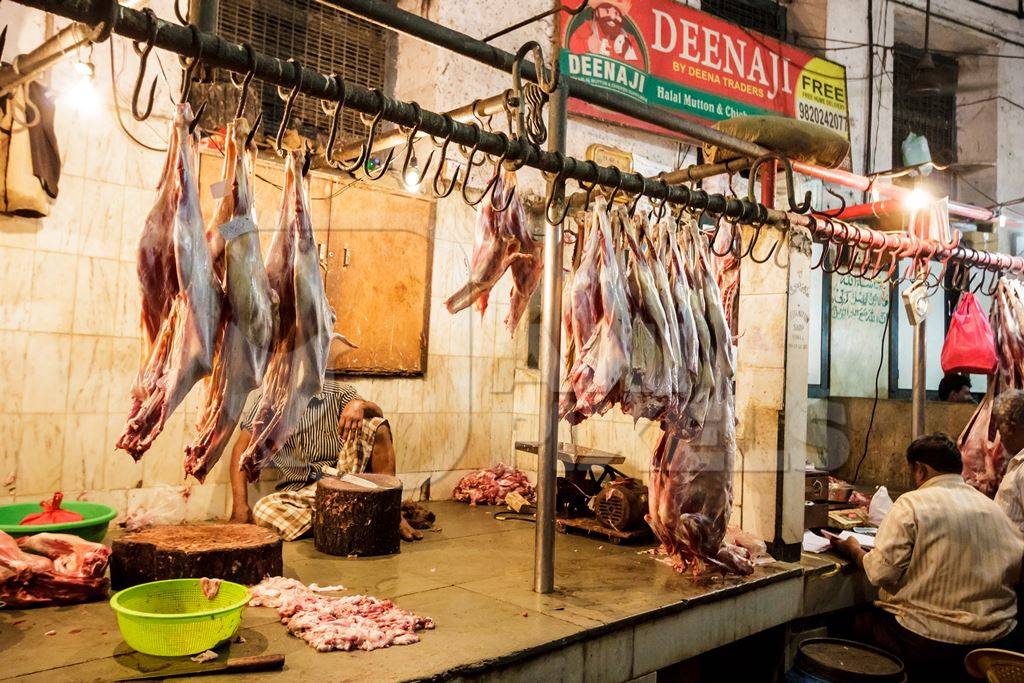 Goat meat hanging up at mutton shops in Crawford meat market Anipixels