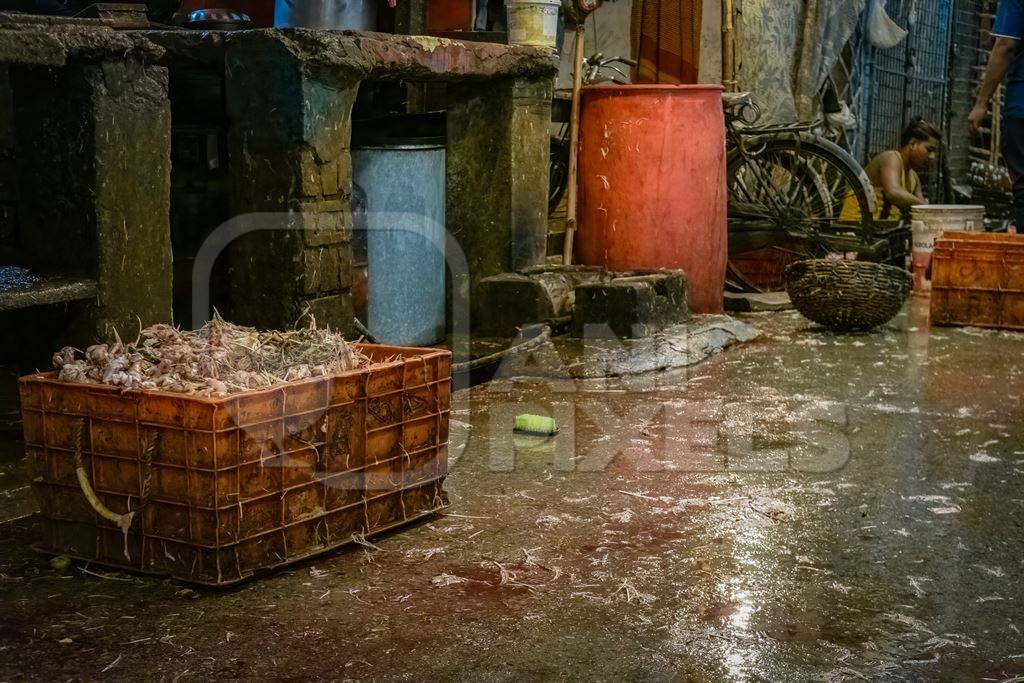 Crate of chicken carcass and dirty floor at the chicken meat market inside New Market, Kolkata, India, 2022