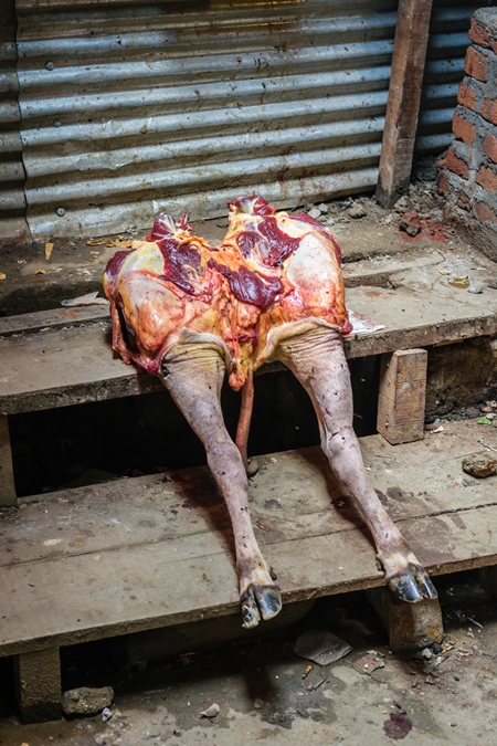 Indian cow or beef legs  outside beef stall or shop at a meat market, Kohima, India, 2018